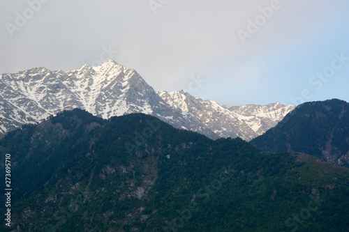 A beautiful view of the Dhauladhar Himalayan Range on a cloudy day at Kareri, Himachal Pradesh, India