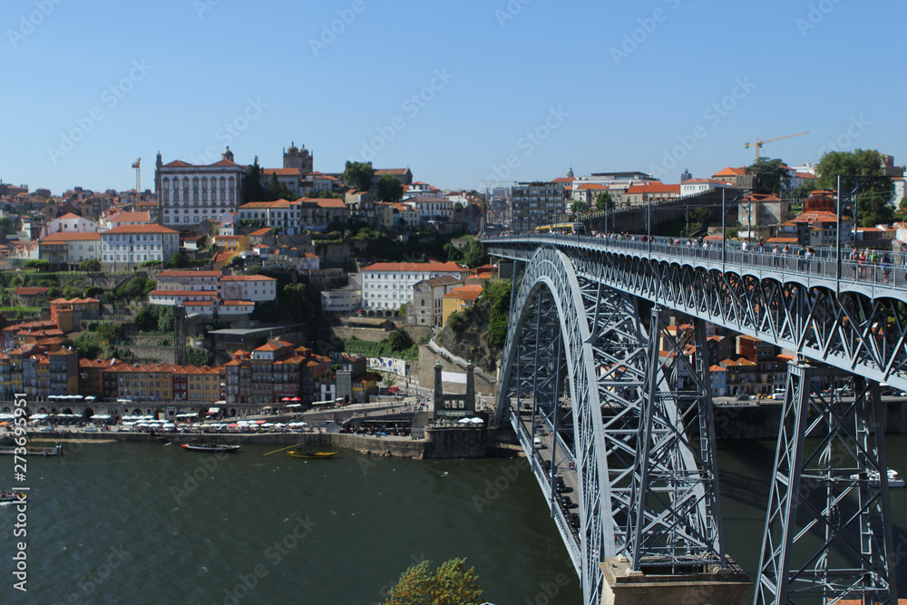 PORTO, PORTUGAL, JUNE 2018: view of the old city of Porto lies on the hills of the right bank of the Douro River and the famous bridge of Ponti di Don Luis I