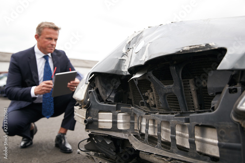 Canvastavla Male Insurance Loss Adjuster With Digital Tablet Inspecting Damage To Car From M
