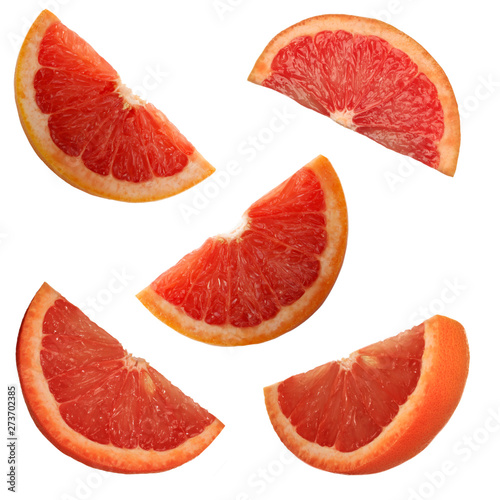set of slices of red grapefruit isolated on white background