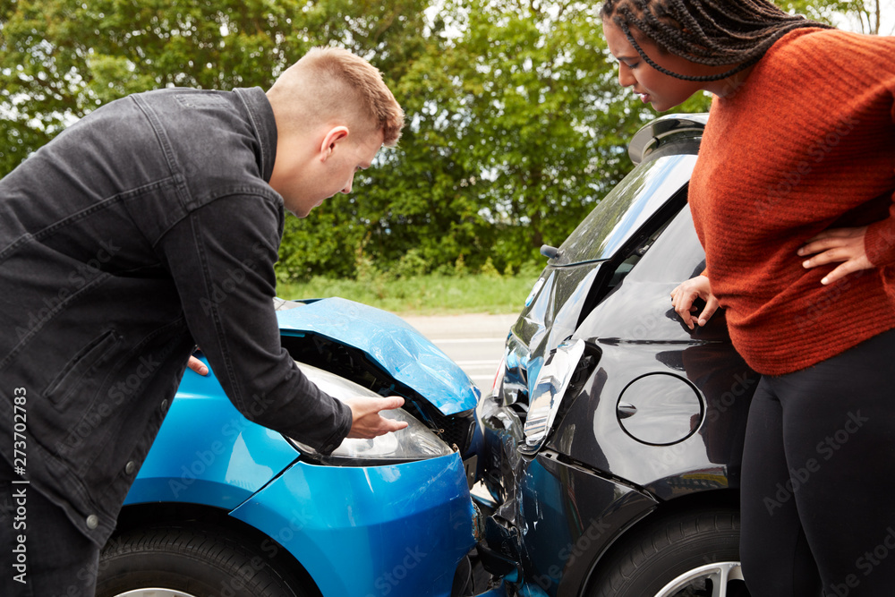 Two Angry Motorists Arguing Over Responsibility For Car Accident Two Angry Motorists Arguing Over Responsibility For Car Accident