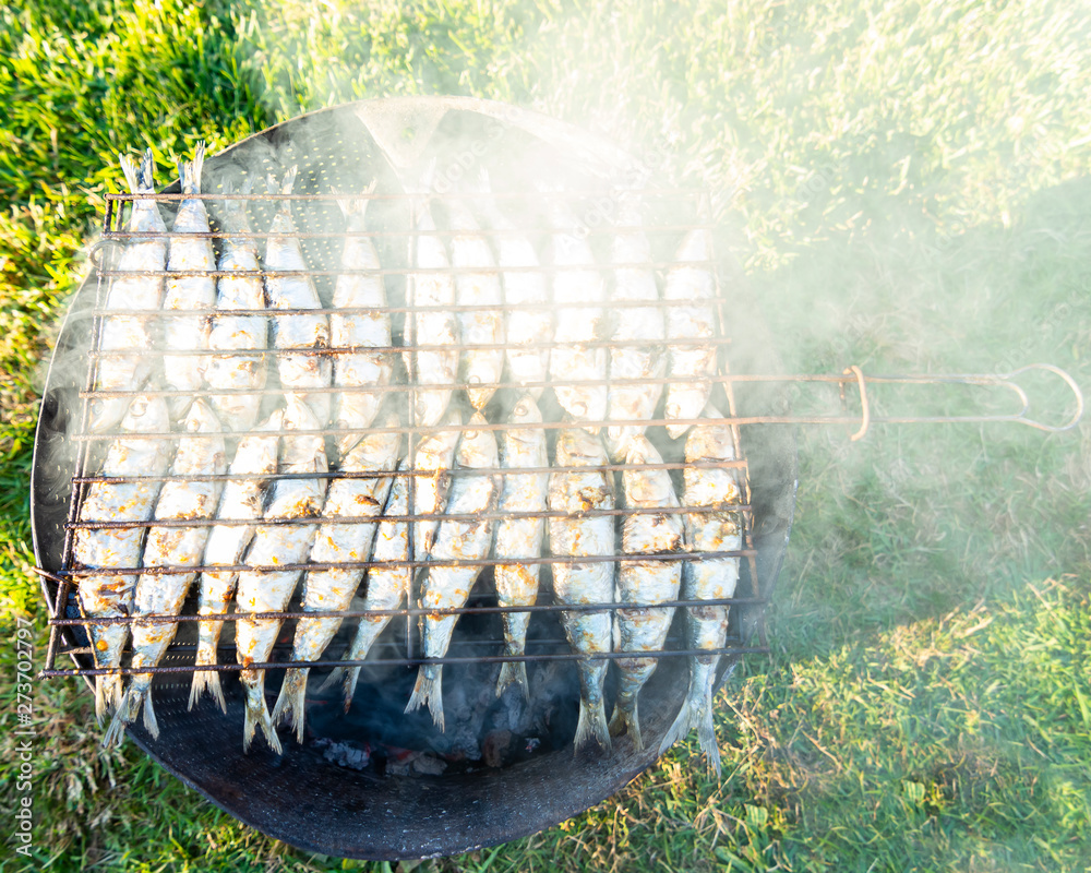 Grilled sardines on the grill