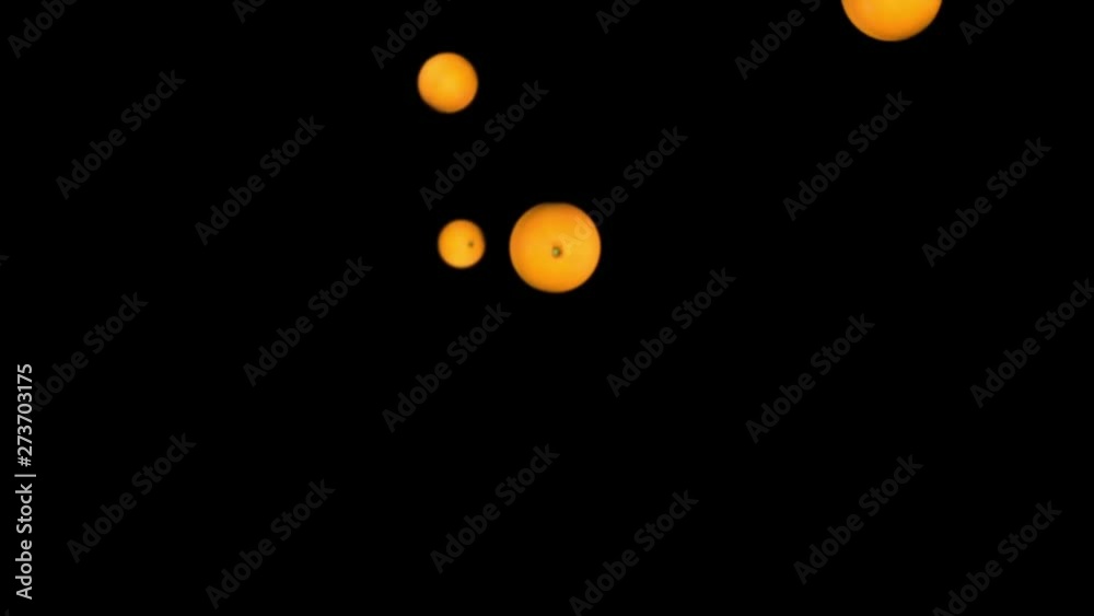 3D animation of falling oranges on a black background 3D animation of falling oranges on a black background