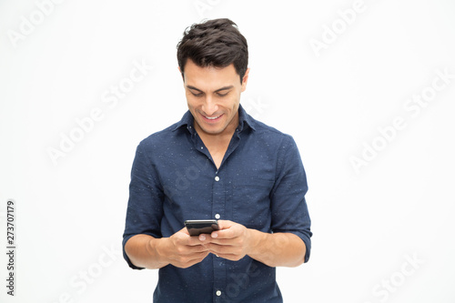 Young man using smartphone and opening application in phone on white background