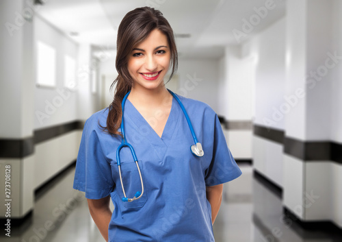 Female doctor portrait in a hospital hall