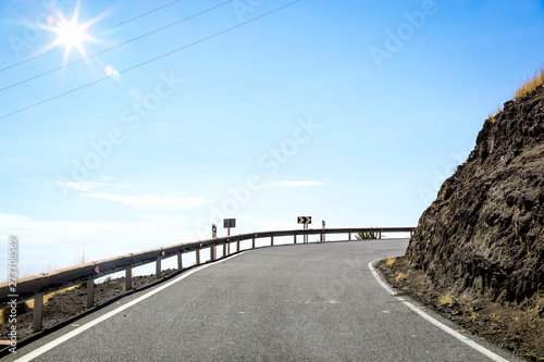 Summer background of road and sea landscape 