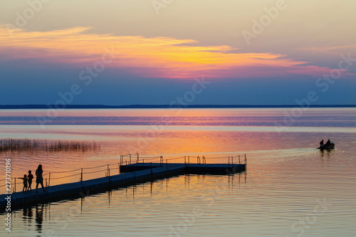 summer sunset on lake wit family and  boat © Maya Kruchancova