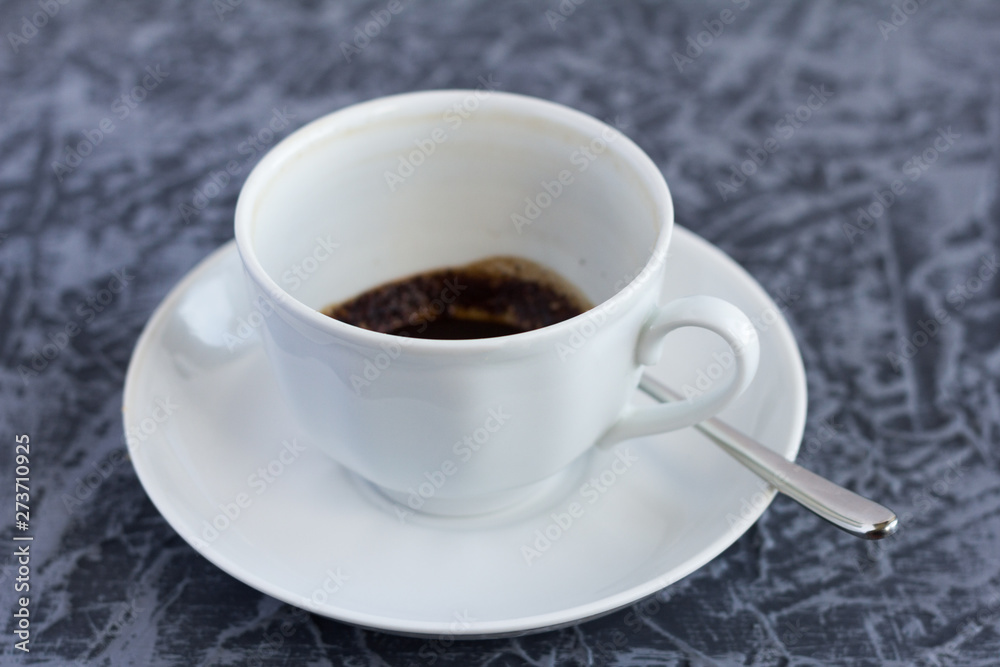 empty dirty Cup after coffee with coffee grounds on the bottom empty dirty Cup after coffee with coffee grounds on the bottom