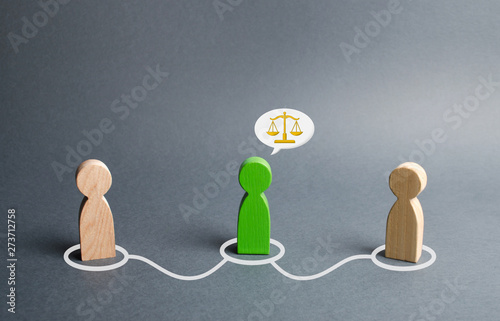 A green man mediates between two people. Judge the two sides and come to a compromise. Negotiations, business deal. Ask for advice from an experienced specialist. Fair resolution of conflict, dispute photo