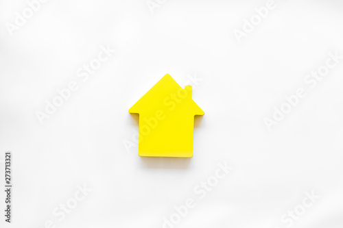 Mortgage credit concept with house toy on white background top view