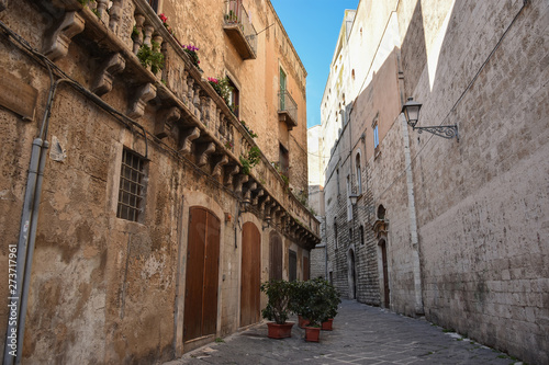 Typical picturesque narrow street in the Old Town of Bari, Puglia region, Southern Italy. © elephotos
