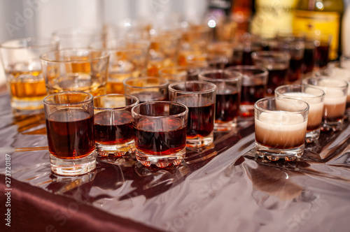 Desserts in the glasses lying on the brown table