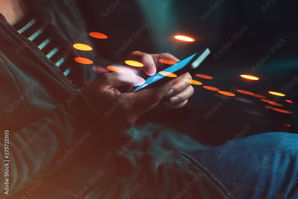Woman texting on mobile phone in car at night - obrazy, fototapety, plakaty 