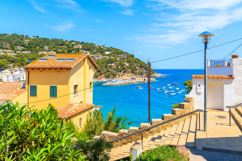 Houses in Llafranc village overlooking beautiful sea bay, Costa Brava, Spain