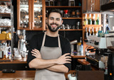 Portrait of smiling barista in coffee shop