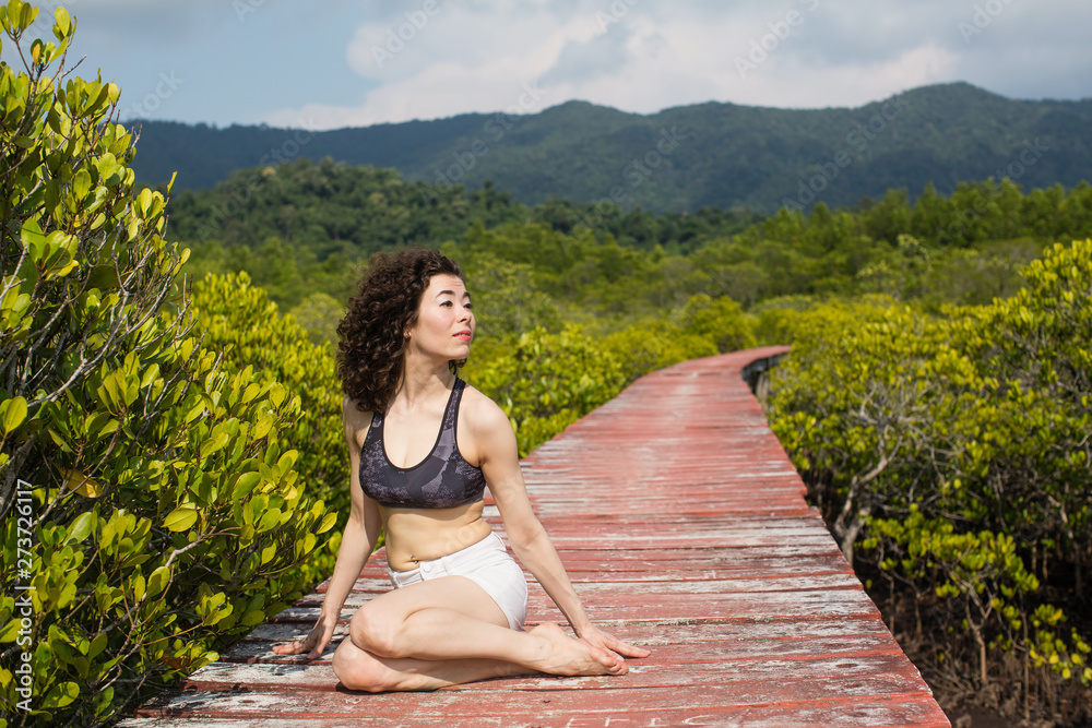 Asian woman in the mangrove forest.