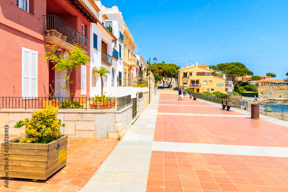 CALELLA DE PALAFRUGELL, SPAIN - JUN 6, 2019: Colorful houses on coastal promenade on Canadell beach in Calella de Palafrugell village, Costa Brava, Catalonia, Spain.
