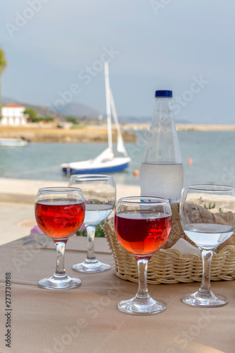 Glasses with wine on the background of the sea close-up © TETYANA