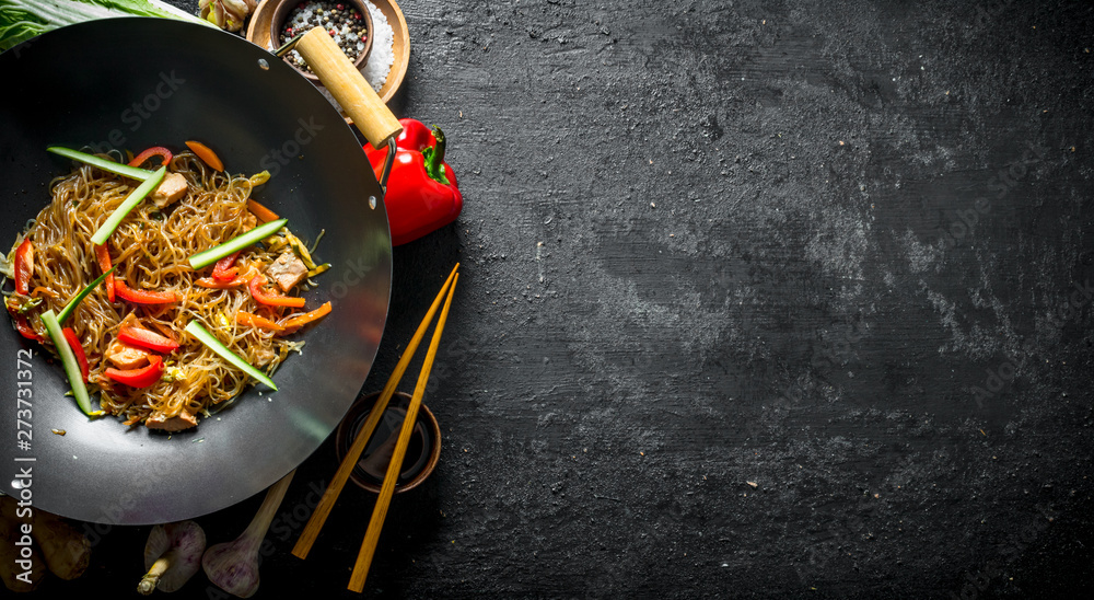 Cooked Chinese noodles cellophane wok with soy sauce in a bowl and with  chopsticks. Stock Photo | Adobe Stock