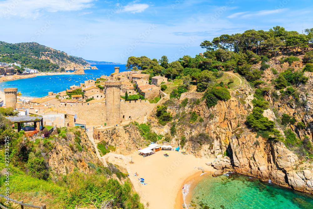 View of beach and castle in Tossa de Mar town, Costa Brava, Spain