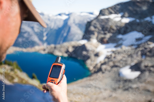 Mountaineer sends a safety message via a satellite communicator