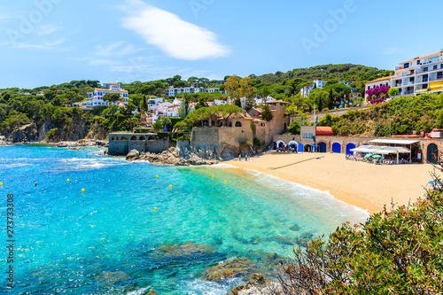 Amazing beach in Calella de Palafrugell  scenic fishing village with white houses and sandy beach with clear blue water  Costa Brava  Catalonia  Spain