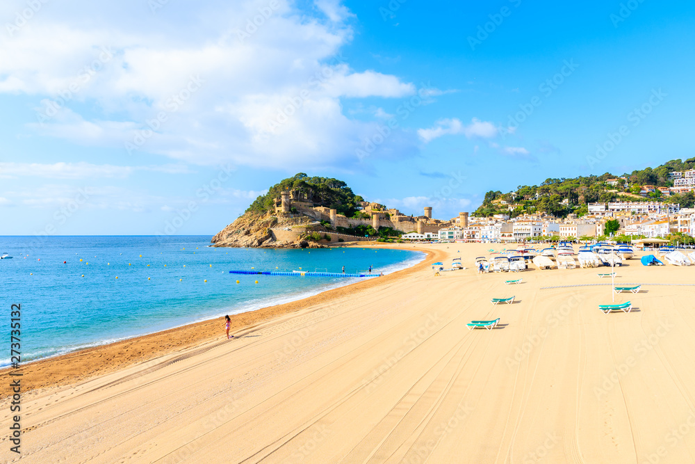 Blue azure sea and sandy beach view in Tossa de Mar, Costa Brava, Spain