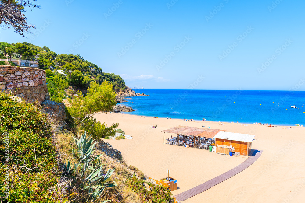 Picturesque bay with restaurant on beach in Sa Riera village, Costa Brava, Spain Picturesque bay with restaurant on beach in Sa Riera village, Costa Brava, Spain