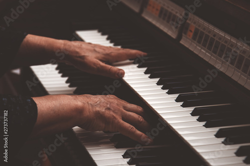 Close up view of a organist playing an organ