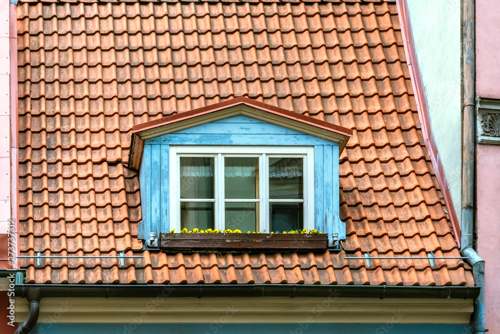 Attic window on the roof. Attic window on the roof.