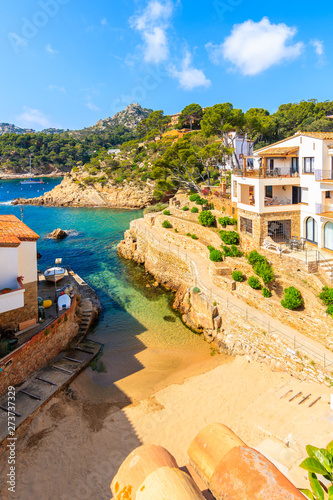 View of beach and holiday apartments in Fornells village, Costa Brava, Spain