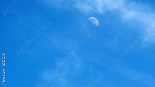 moon on a blue sky day photo