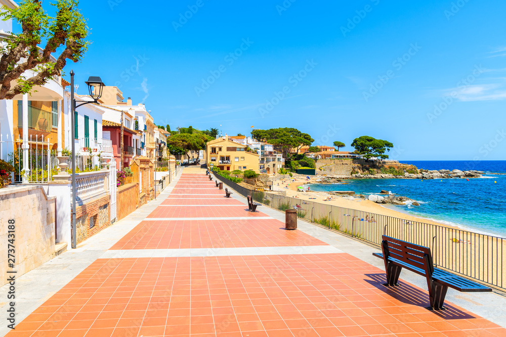 Colorful houses on coastal promenade on Canadell beach in Calella de Palafrugell village, Costa Brava, Catalonia, Spain