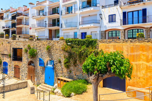 Houses in Calella de Palafrugell, scenic fishing village with white houses and sandy beach with clear blue water, Costa Brava, Catalonia, Spain © pkazmierczak