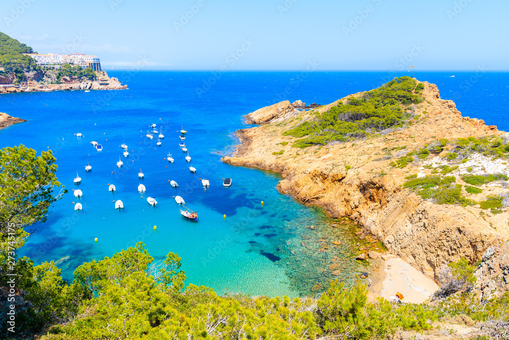 Boats in beautiful sea bay with beach near Sa Tuna village, Costa Brava, Spain