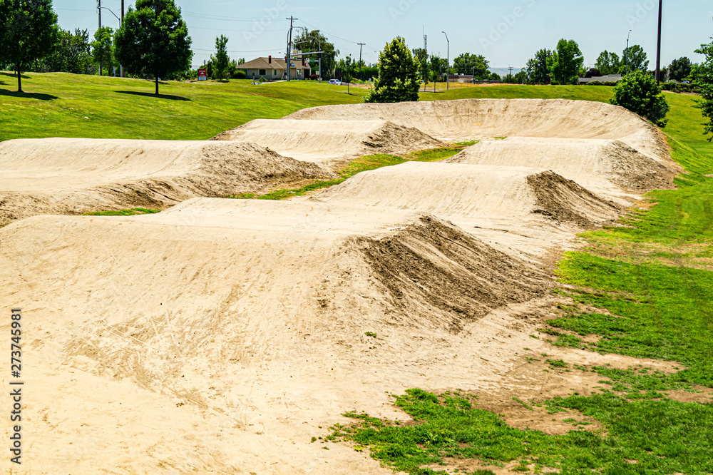 Empty dirt racing course for cycling on a clear summer day Empty dirt racing course for cycling on a clear summer day