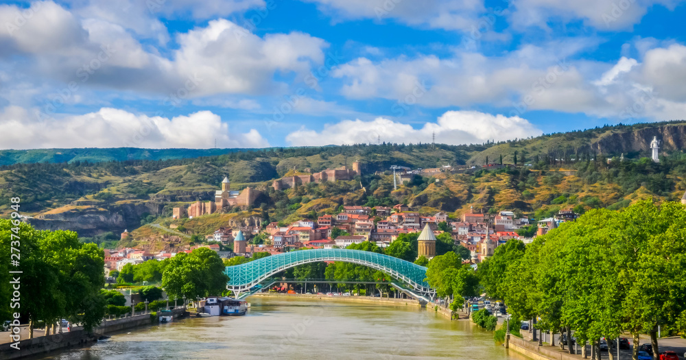 Hills of old Tbilisi and modern glass Peace bridge, Georgia