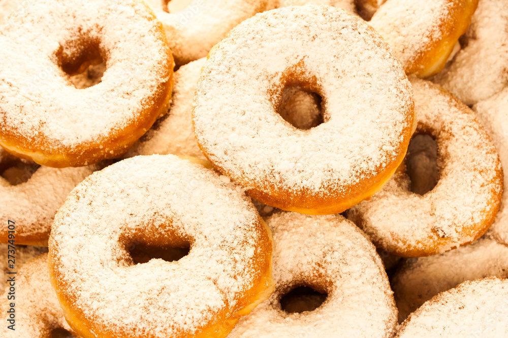 Lots of tasty sweet homemade donuts with powder