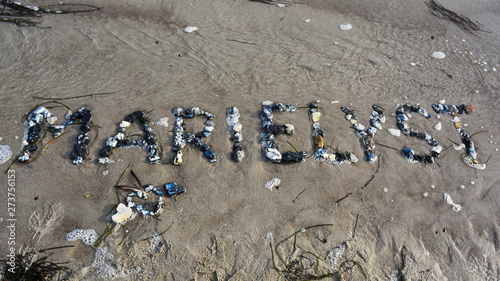 font made of stones at the beach of marielyst, danmark