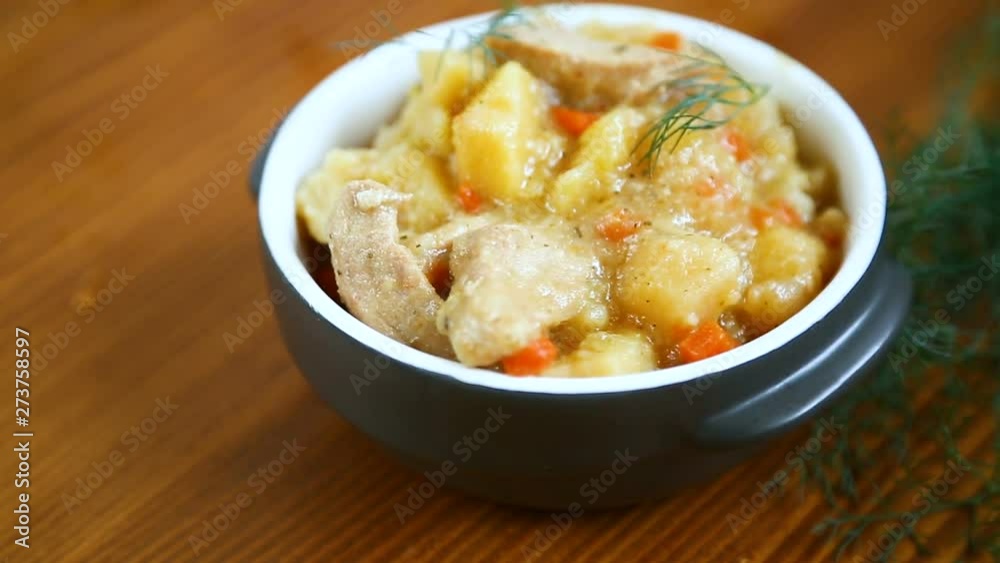 stewed potatoes with vegetables, cabbage and meat in a bowl stewed potatoes with vegetables, cabbage and meat in a bowl