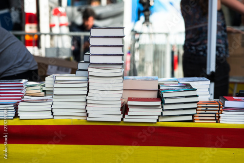 BARCELONA, SPAIN - APRIL 23, 2017: Preparation of a books stand in the celebration of San Jordi. photo