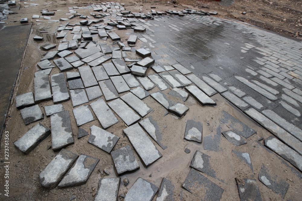 poor quality paving stones, road blurred, road repair close up poor quality paving stones, road blurred, road repair close up