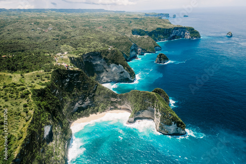Bird's-eye view. Aerial drone view of cliff near Kelingking beach. Manta Bay or Kelingking Beach on Nusa Penida Island, Bali, Indonesia.