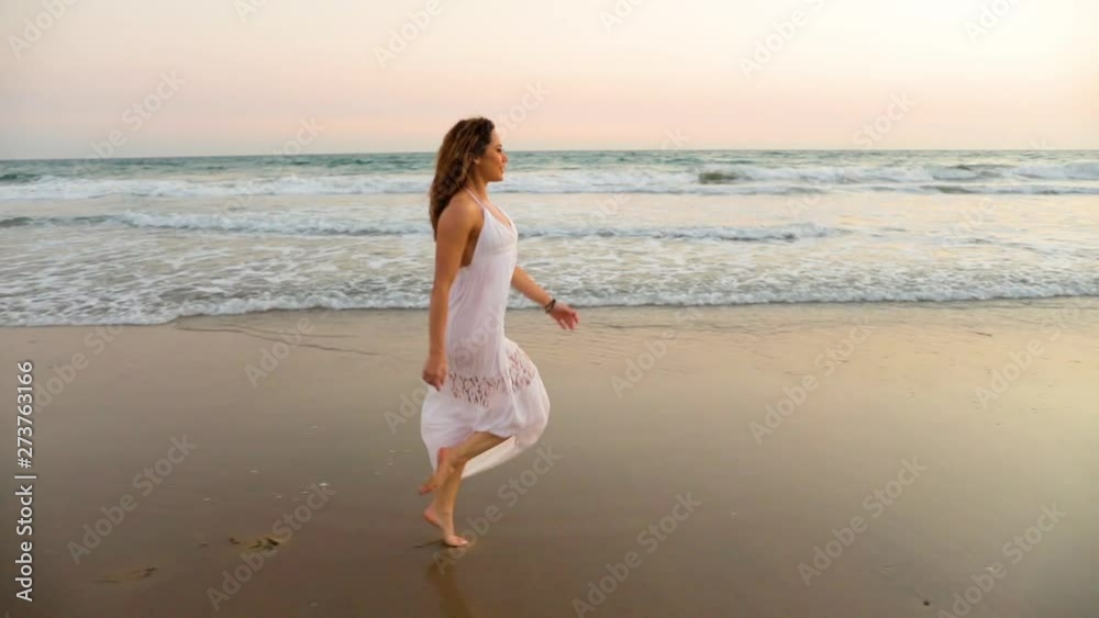 Beautiful woman enjoying the beach at sunset. Beautiful woman enjoying the beach at sunset.