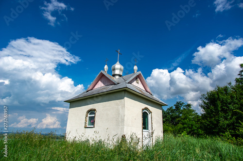 Little chapel on a summer day by the river photo