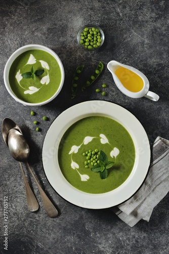 Cream of green pea soup with mint. Healthy food. Top view.