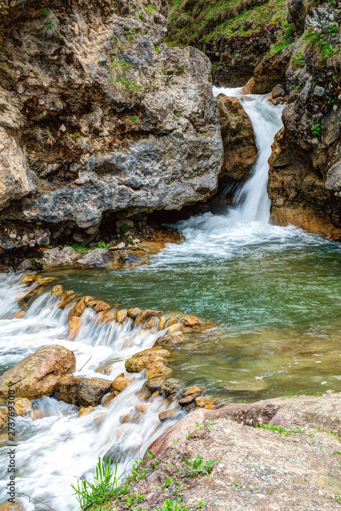 Mountain waterfalls in early spring. Mountain waterfalls in early spring.