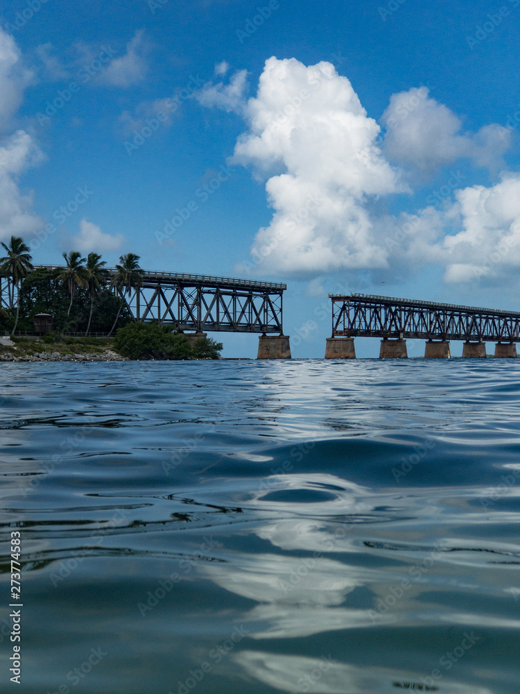 Ocean view of the old Flagler Railroad bridge spanning across Bahia Honda from the water