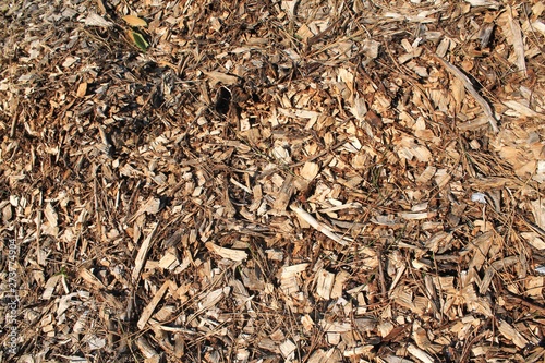 Pile of composting wood chips abstract horizontal background texture