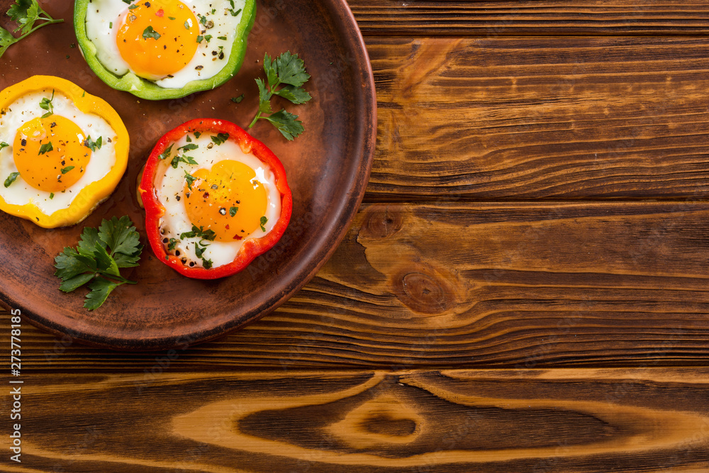 Yellow , red and green pepper with fried eggs Yellow , red and green pepper with fried eggs
